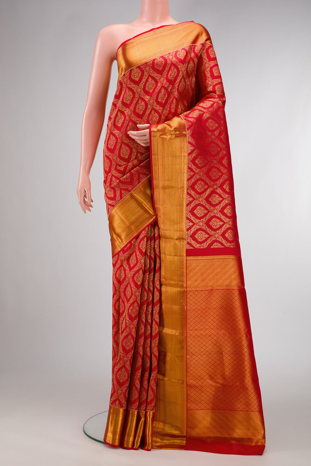 Red Dual Tone Kanchipuram Silk Saree with Zari Brocade on the body and Zari Border.  displayed on a mannequin