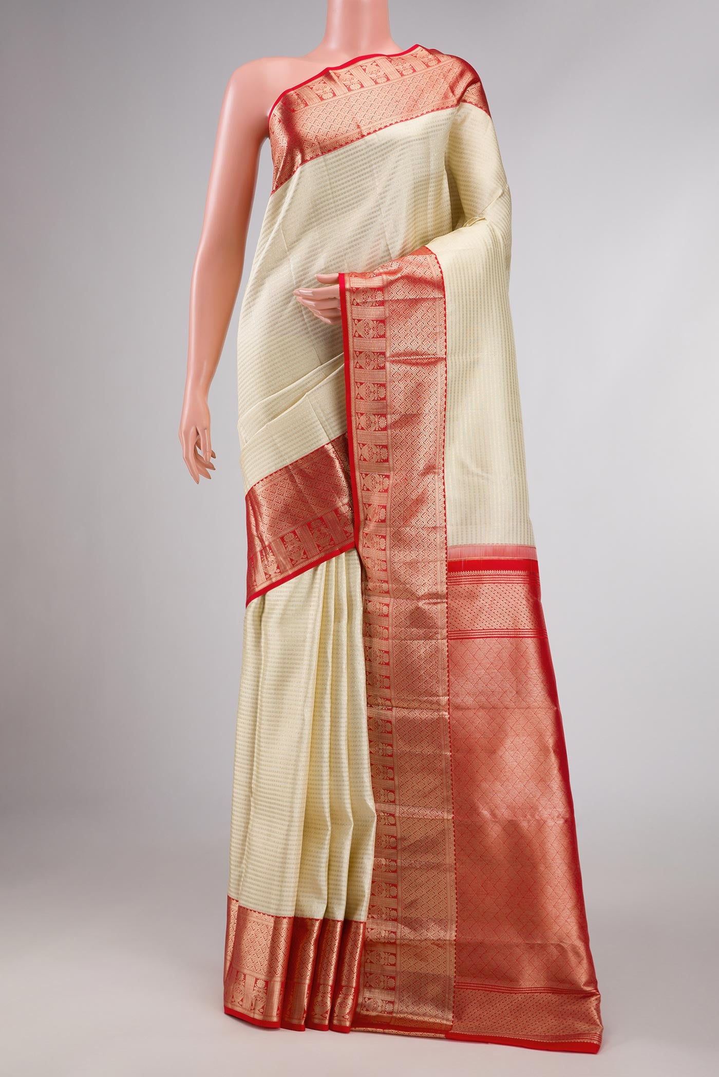 Off White Dual Tone Kanchipuram Silk Saree with Zari Brocade on the body and Zari Border displayed on a mannequin