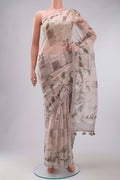 Mauve Organza Silk Saree with Printed design on the body and Plain Border displayed on a mannequin