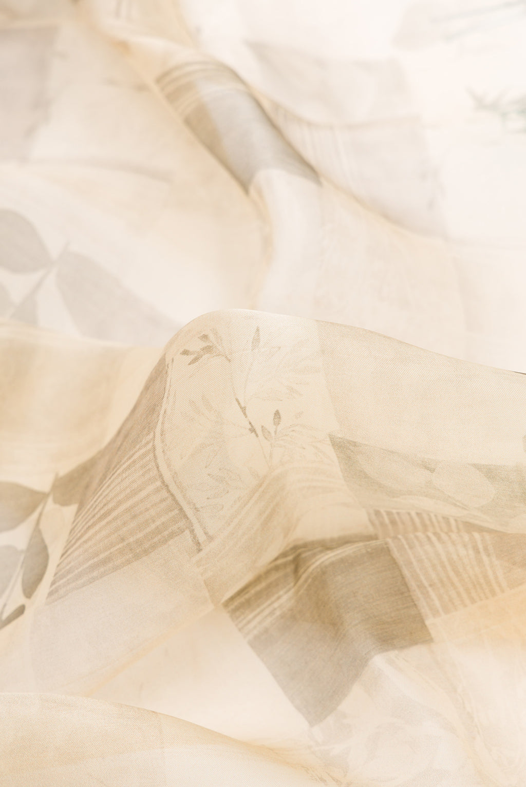 Close up of Sandal Dual Tone Organza Silk Saree with Printed design on the body and Zari Border.  displaying folds