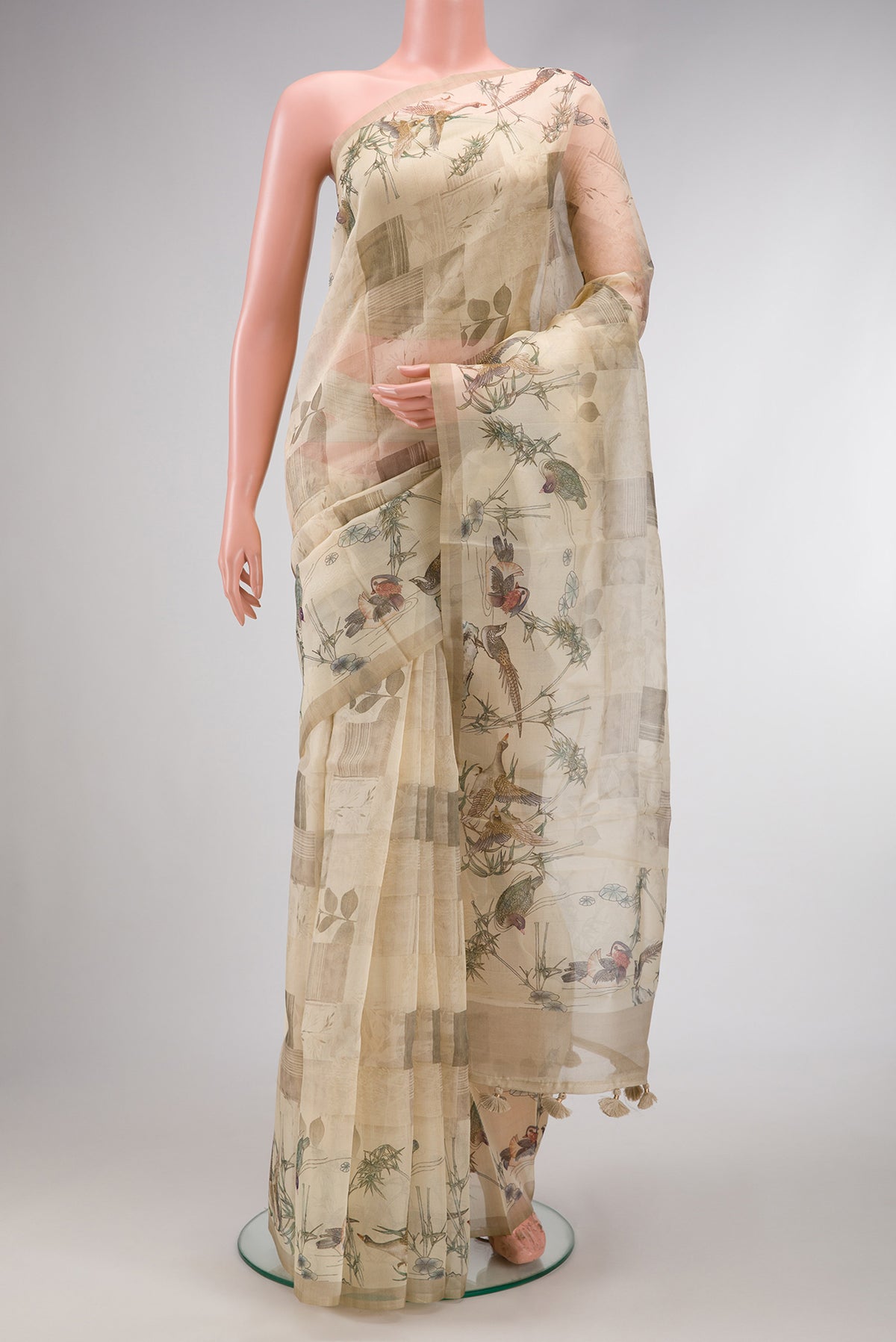 Sandal Dual Tone Organza Silk Saree with Printed design on the body and Zari Border.  displayed on a mannequin