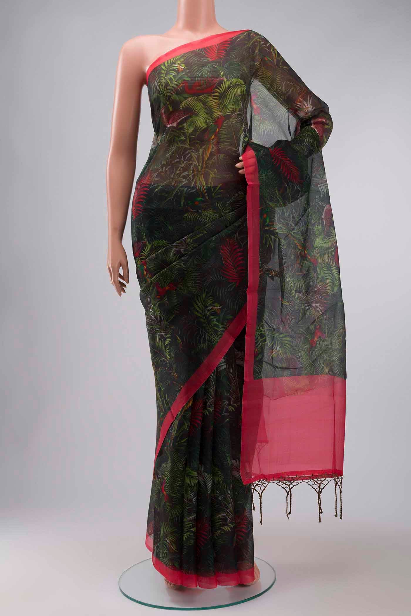 Green Organza Silk Saree with Printed design on the body and Plain Border displayed on a mannequin