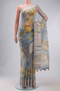 Grey Organza Silk Saree with Printed design on the body and Zari Border displayed on a mannequin