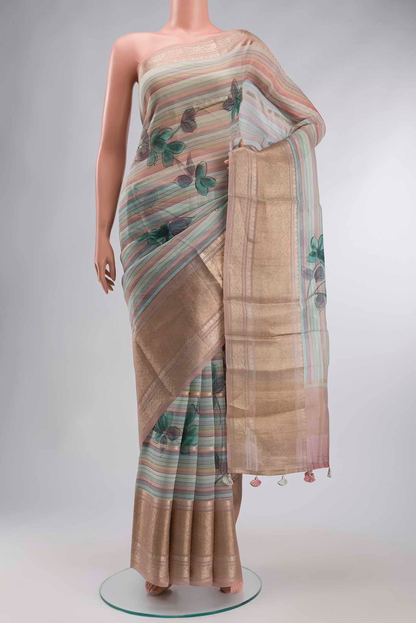 Blue Organza Silk Saree with Stripes on the body and Zari Border displayed on a mannequin