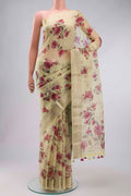 Yellow Organza Silk Saree with Printed design on the body and Zari Border displayed on a mannequin