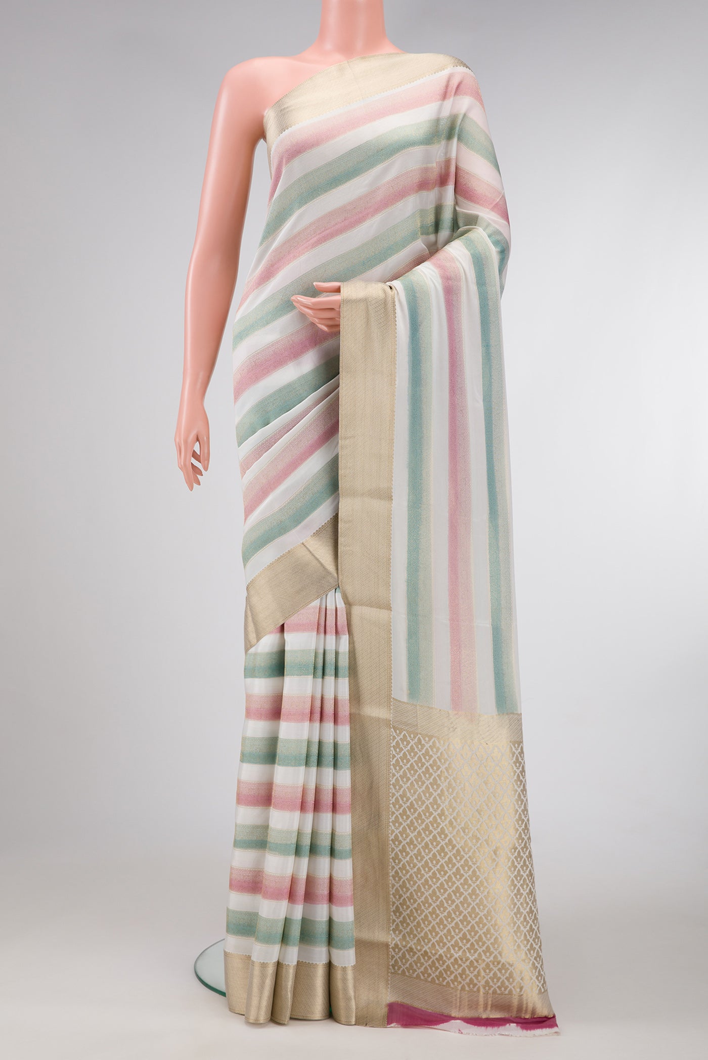 Pink and Green Color Mysore Silk Saree with Stripes on the body and Zari Border.  displayed on a mannequin