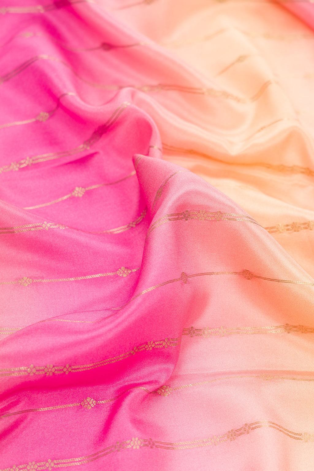 Close up of Pink, Sea Green and Peach Color Mysore Silk Saree with Stripes on the body and Zari Border.  displaying folds