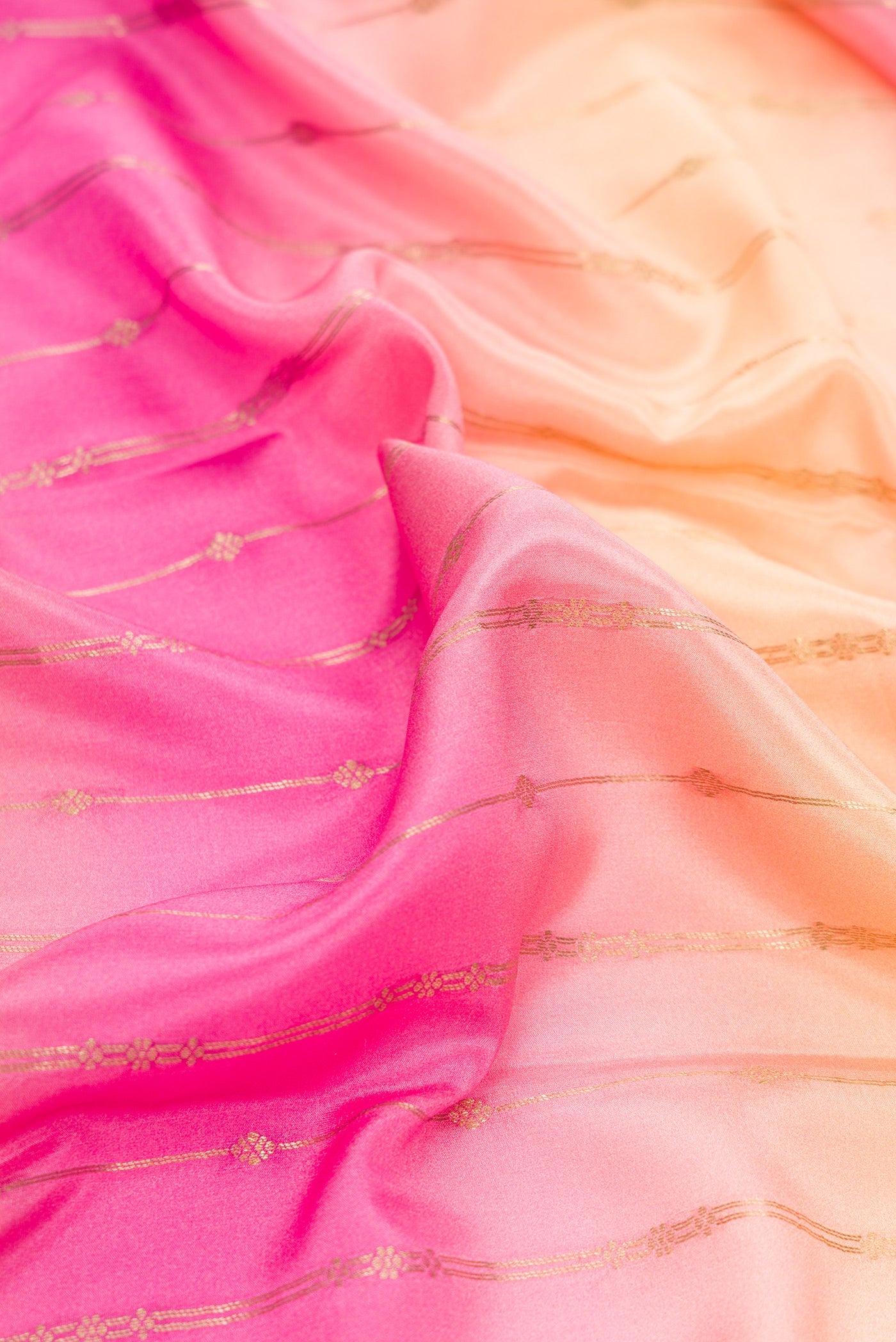 Close up of Pink, Sea Green and Peach Color Mysore Silk Saree with Stripes on the body and Zari Border.  displaying folds