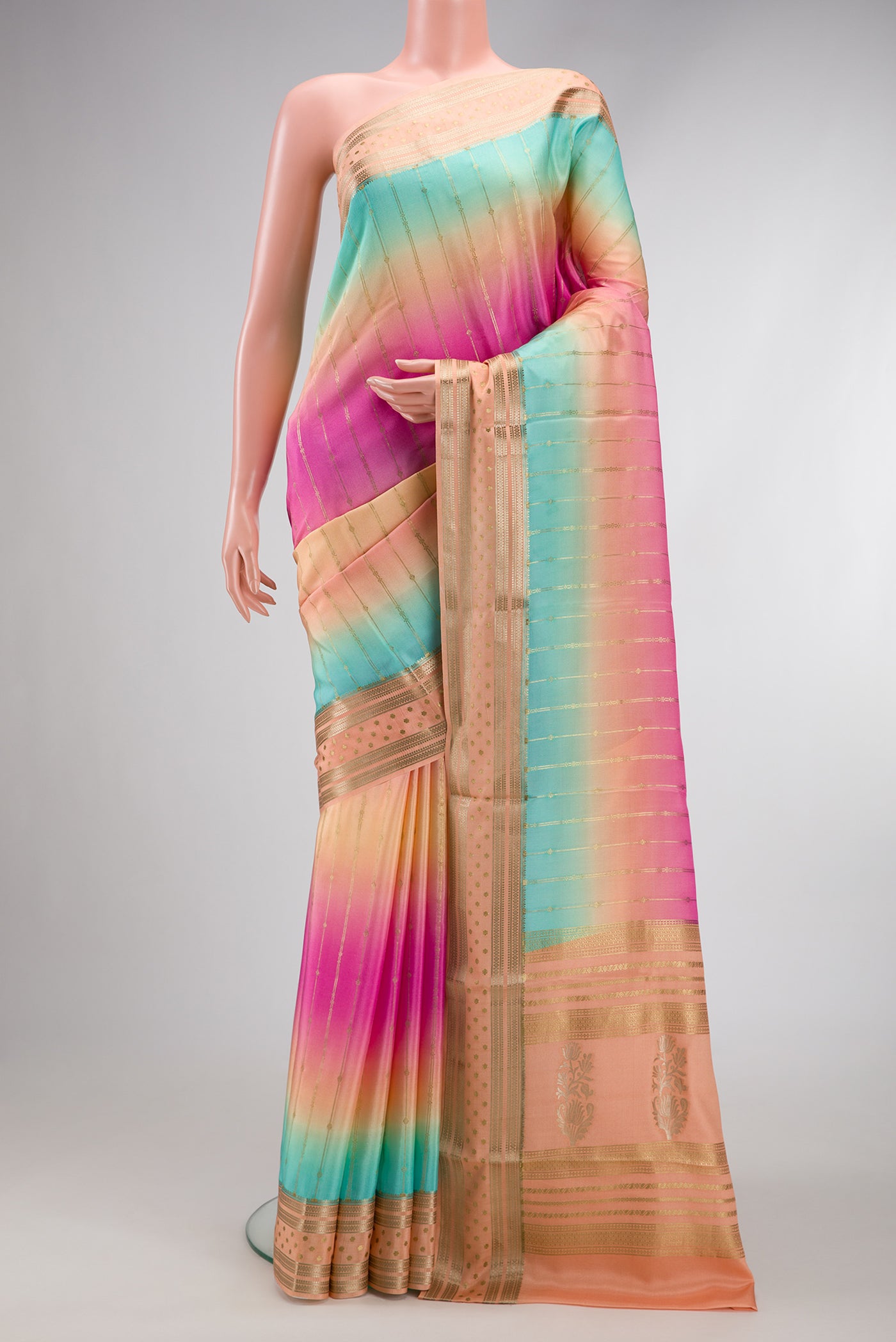 Pink, Sea Green and Peach Color Mysore Silk Saree with Stripes on the body and Zari Border.  displayed on a mannequin