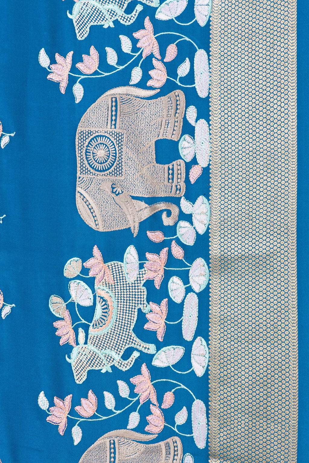 Border image of Peacock Blue Dual Tone Mysore Silk Saree with Checked design on the body and Embroidery Border. 