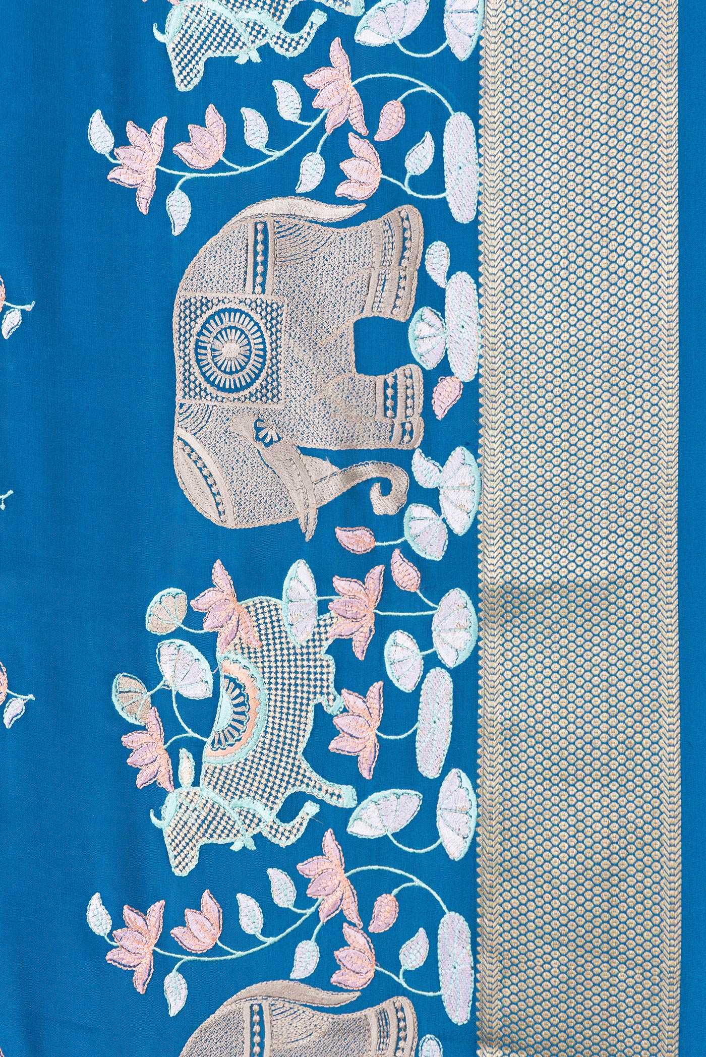 Border image of Peacock Blue Dual Tone Mysore Silk Saree with Checked design on the body and Embroidery Border. 