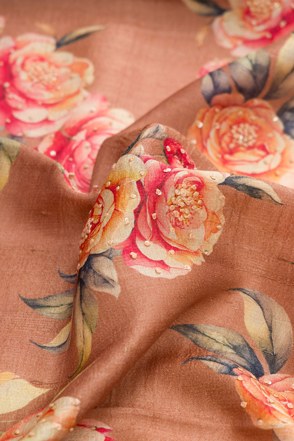 Close up of Brown Dual Tone Tussar Silk Saree with Printed design on the body and Thin Zari Line.  displaying folds