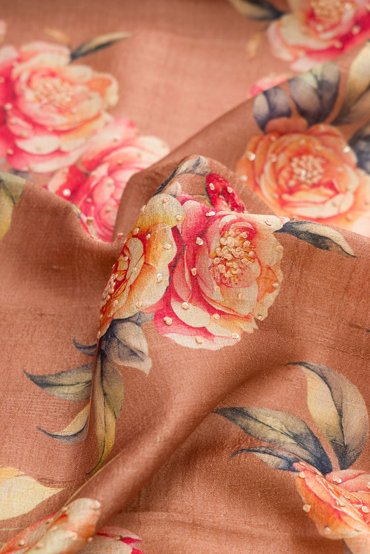 Close up of Brown Dual Tone Tussar Silk Saree with Printed design on the body and Thin Zari Line.  displaying folds