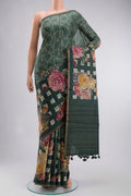 Green Tussar Silk Saree with Embroidery on the body and Zari And Thread Border displayed on a mannequin