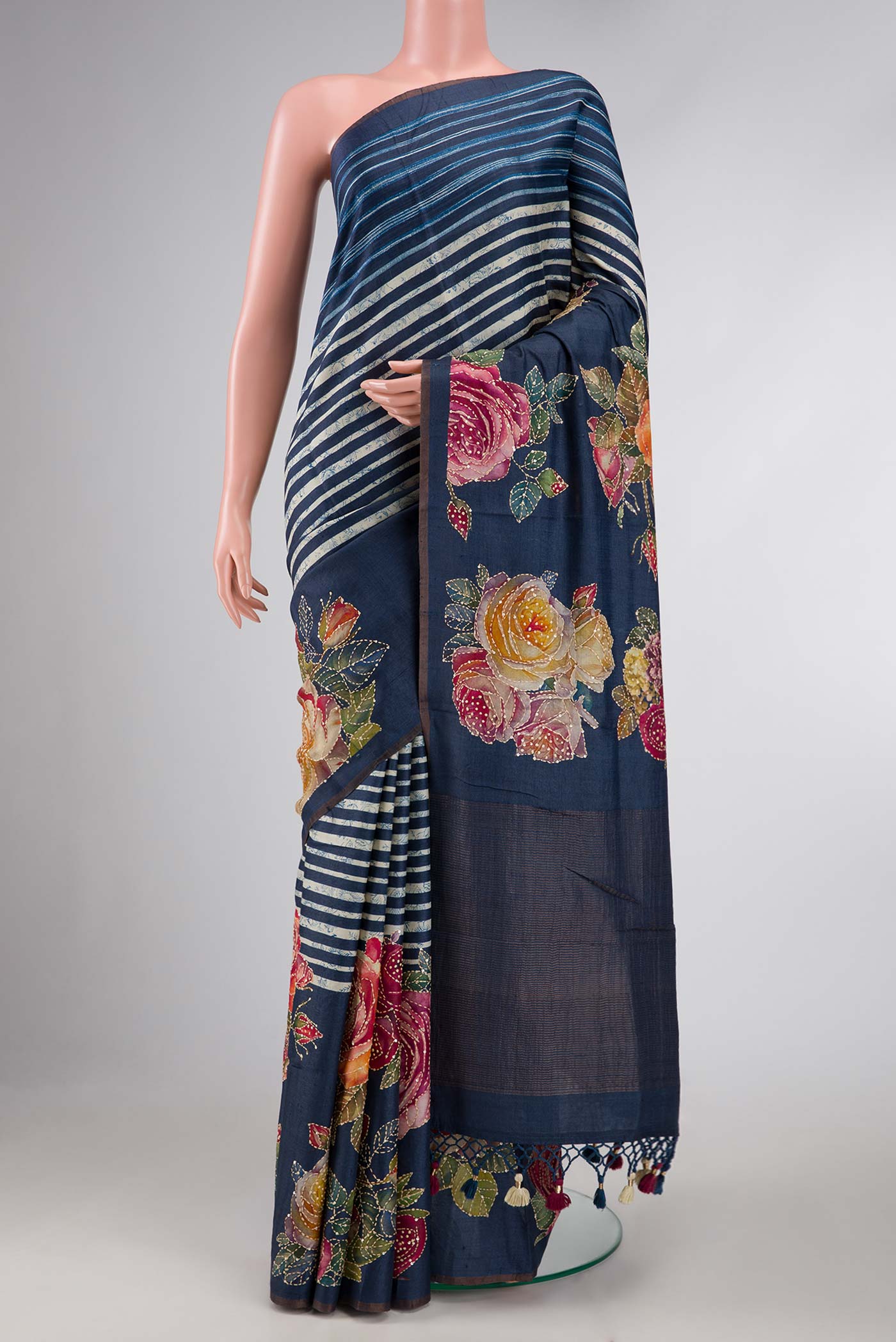 Navy Blue Dual Tone Tussar Silk Saree with Printed design on the body and Embroidery Border displayed on a mannequin