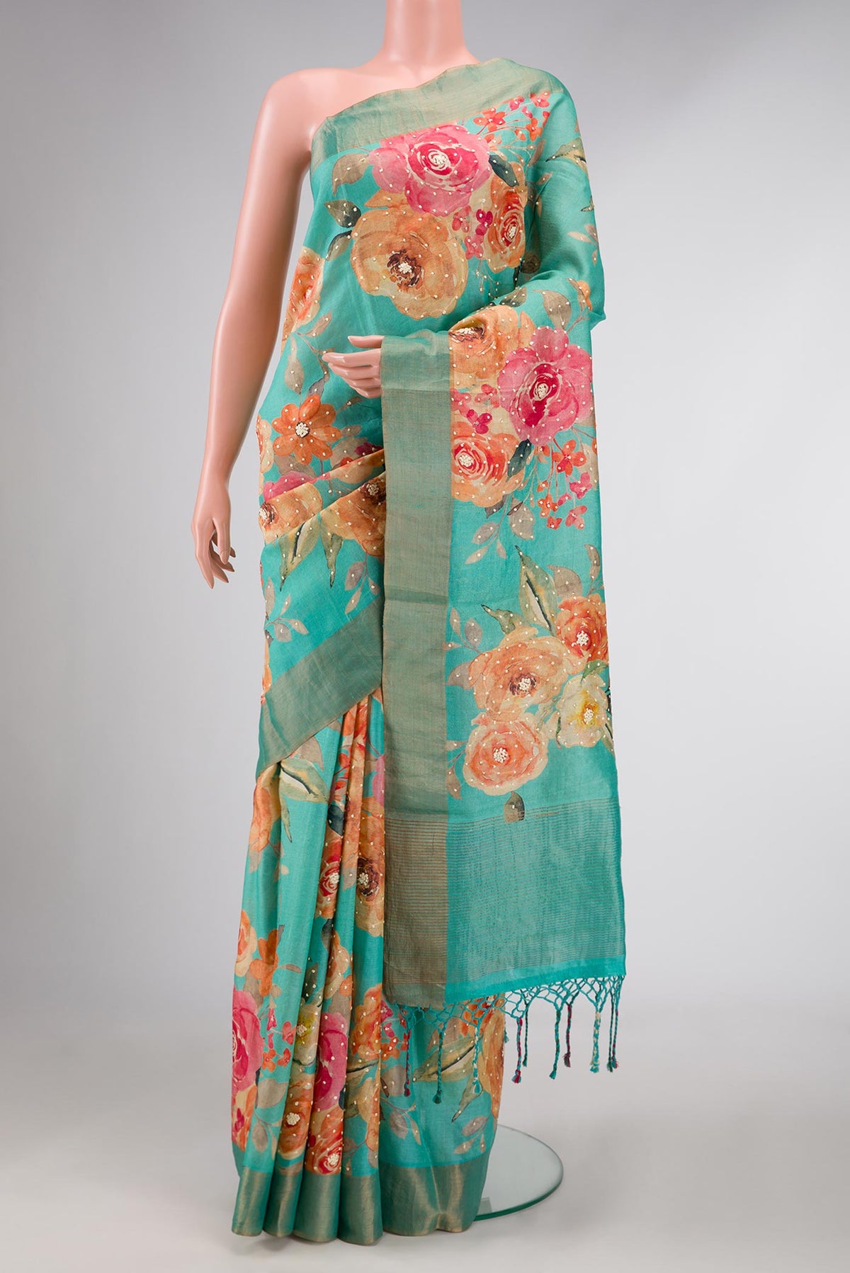 Light Green Dual Tone Tussar Silk Saree with Embroidery on the body and Plain Border displayed on a mannequin