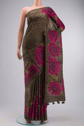 Green Tussar Silk Saree with Printed design on the body and Embroidery Border displayed on a mannequin