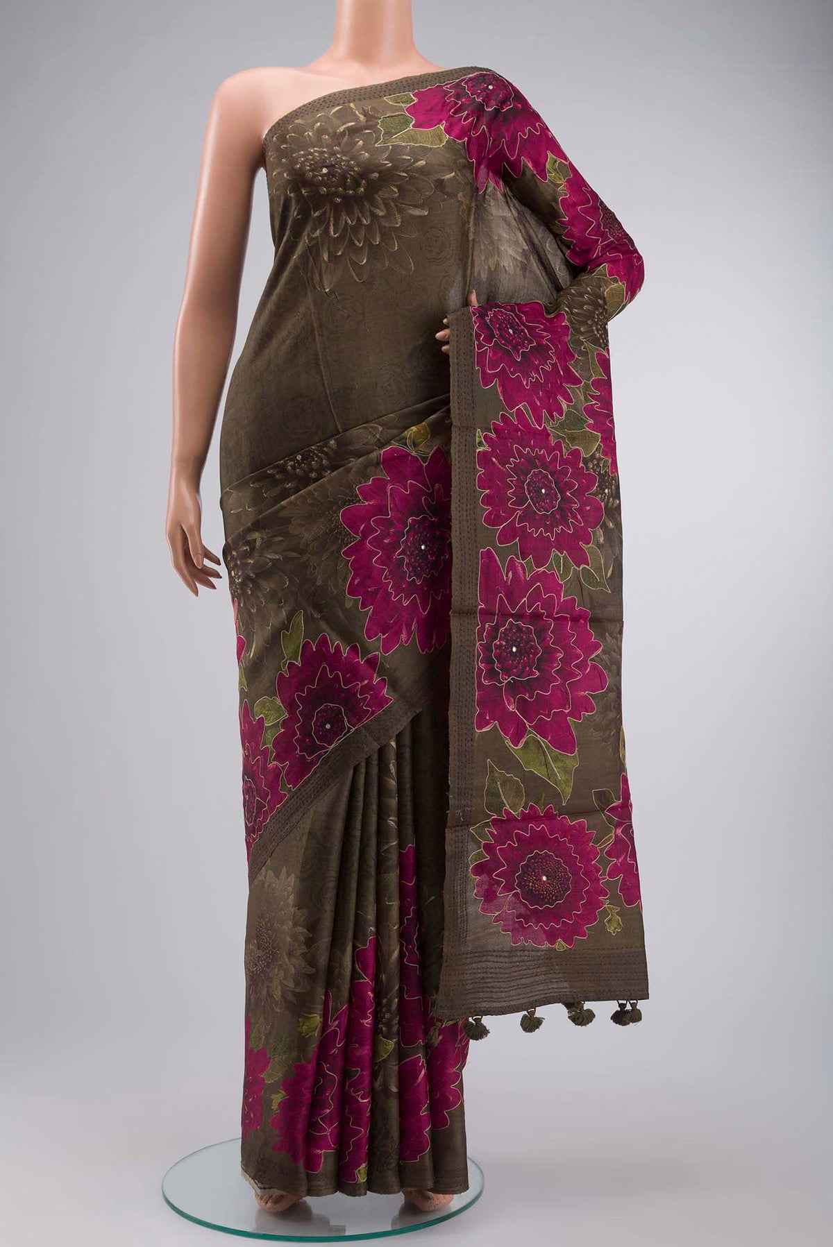 Green Tussar Silk Saree with Printed design on the body and Embroidery Border displayed on a mannequin