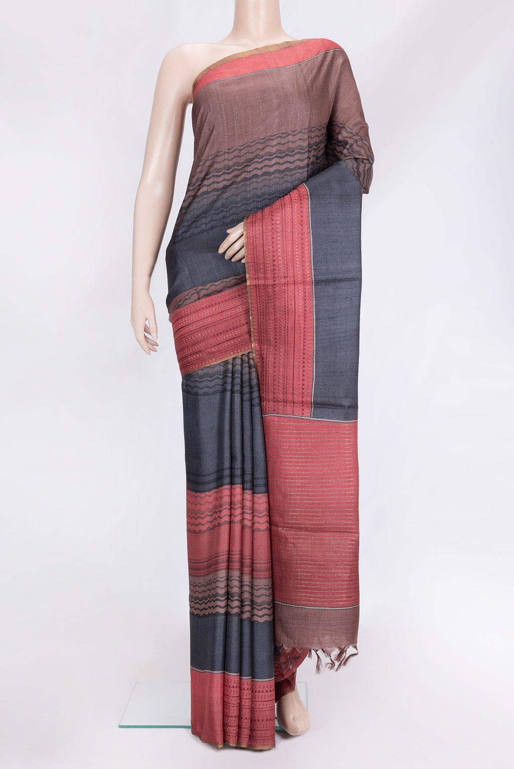 Navy Blue Dual Tone Tussar Silk Saree with Printed design on the body and Embroidery Border.  displayed on a mannequin