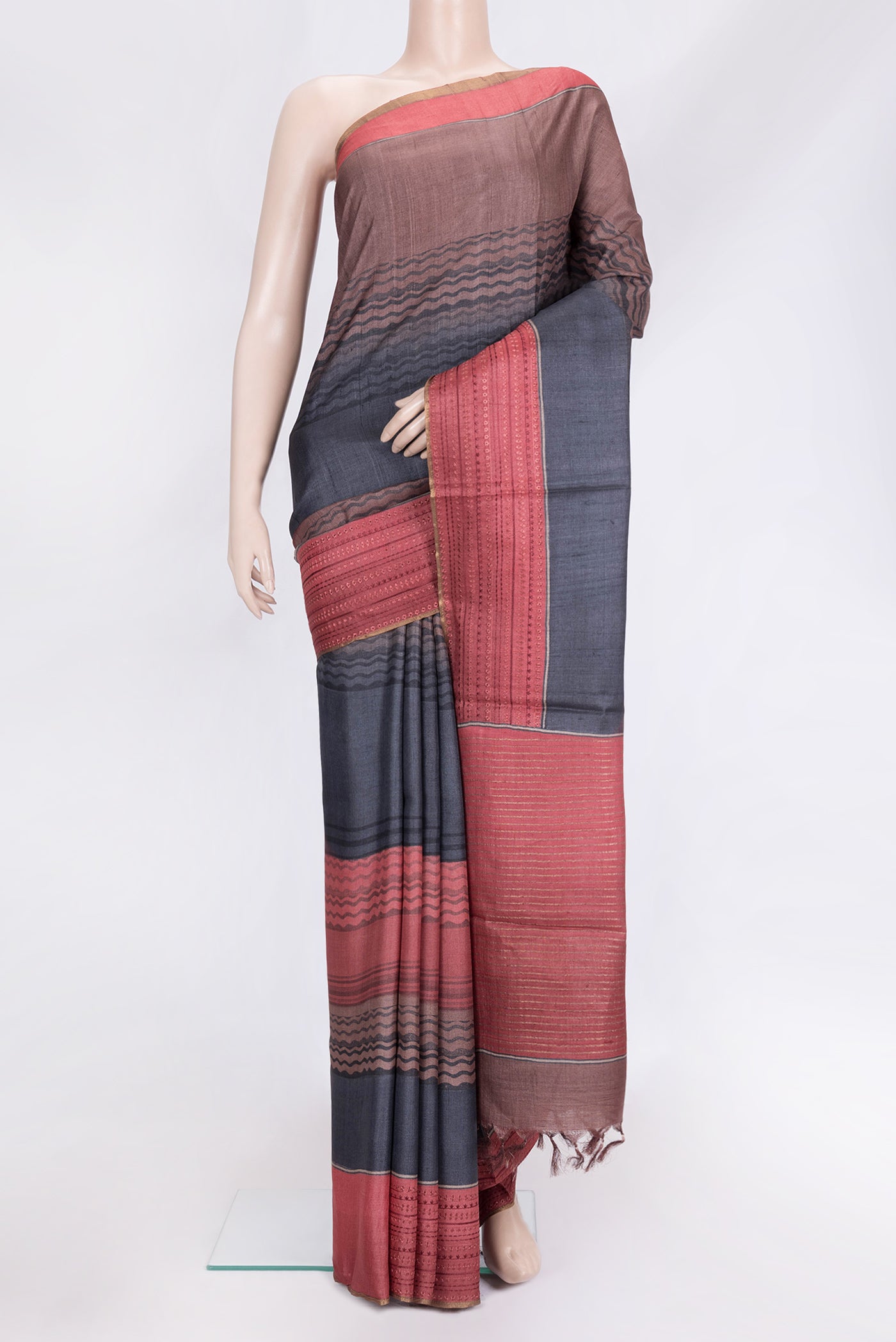Navy Blue Dual Tone Tussar Silk Saree with Printed design on the body and Embroidery Border.  displayed on a mannequin