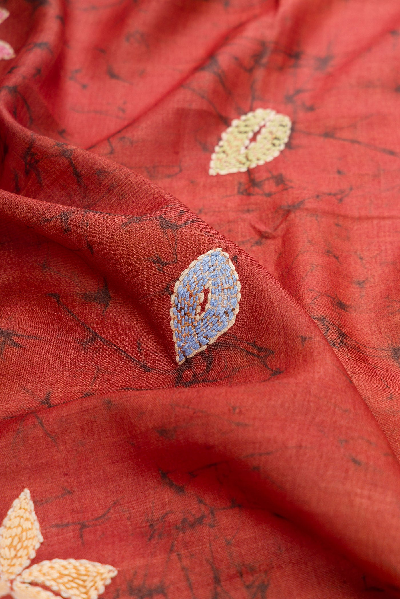 Close up of Brown Dual Tone Tussar Silk Saree with Embroidery on the body and Embroidery Border.  displaying folds