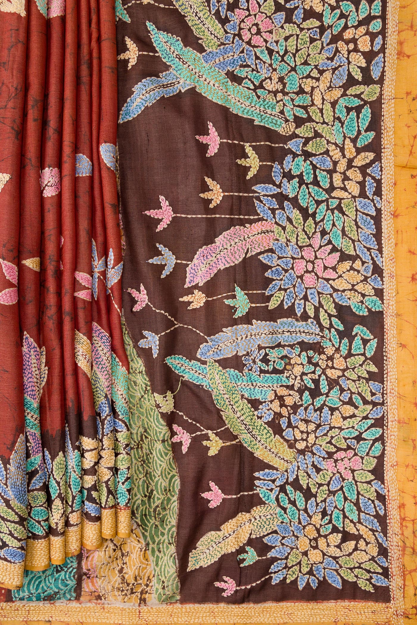 Pleats and pallu of Brown Dual Tone Tussar Silk Saree with Embroidery on the body and Embroidery Border. 