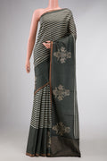 Green Dual Tone Tussar Silk Saree with Stripes on the body and Fancy Border displayed on a mannequin
