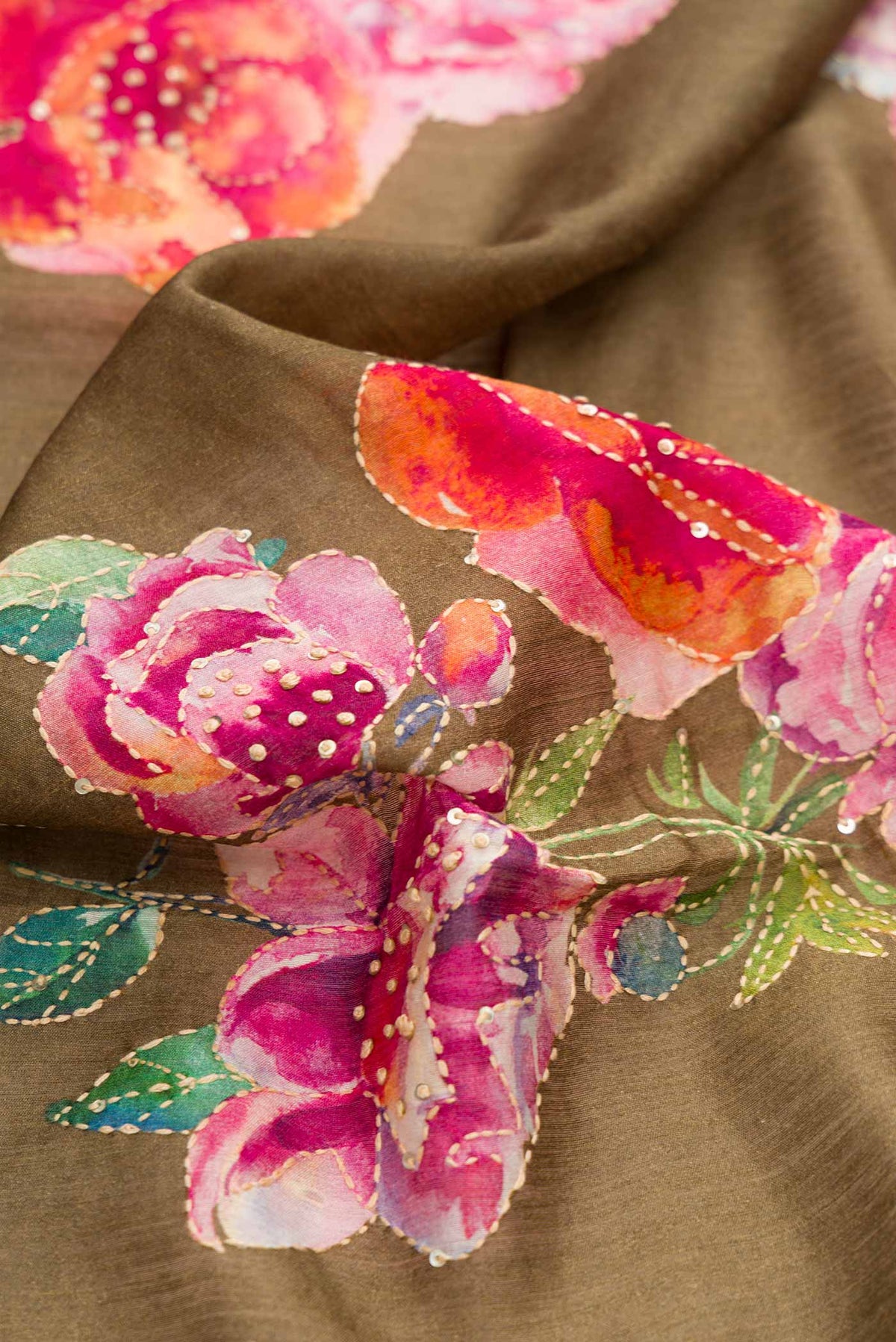 Close up of Mehandi Green Dual Tone Tussar Silk Saree with Printed design on the body and Zari Border displaying folds
