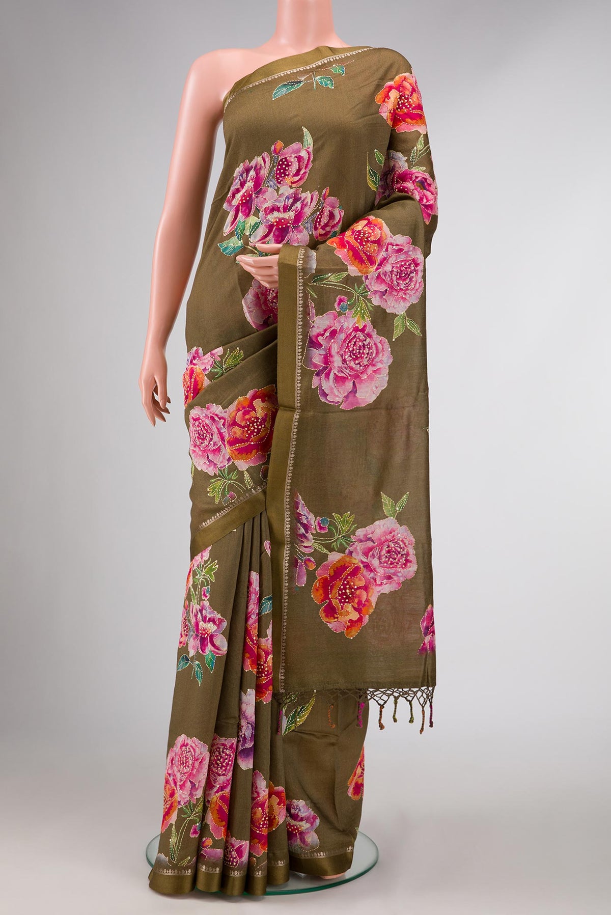 Mehandi Green Dual Tone Tussar Silk Saree with Printed design on the body and Zari Border displayed on a mannequin