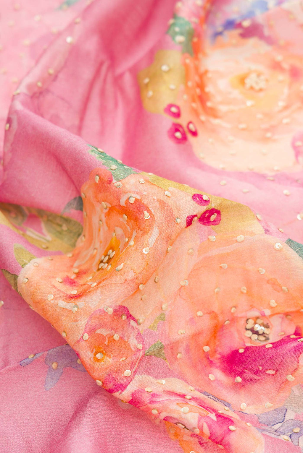 Close up of Pink Dual Tone Tussar Silk Saree with Printed design on the body and Zari Border displaying folds