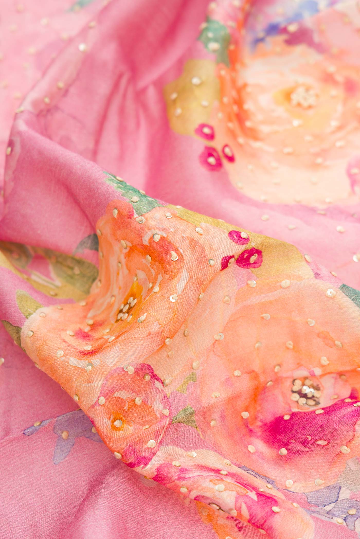 Close up of Pink Dual Tone Tussar Silk Saree with Printed design on the body and Zari Border displaying folds