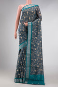 Davys Grey Dual Tone Tussar Silk Saree with Printed design on the body and Zari Border displayed on a mannequin