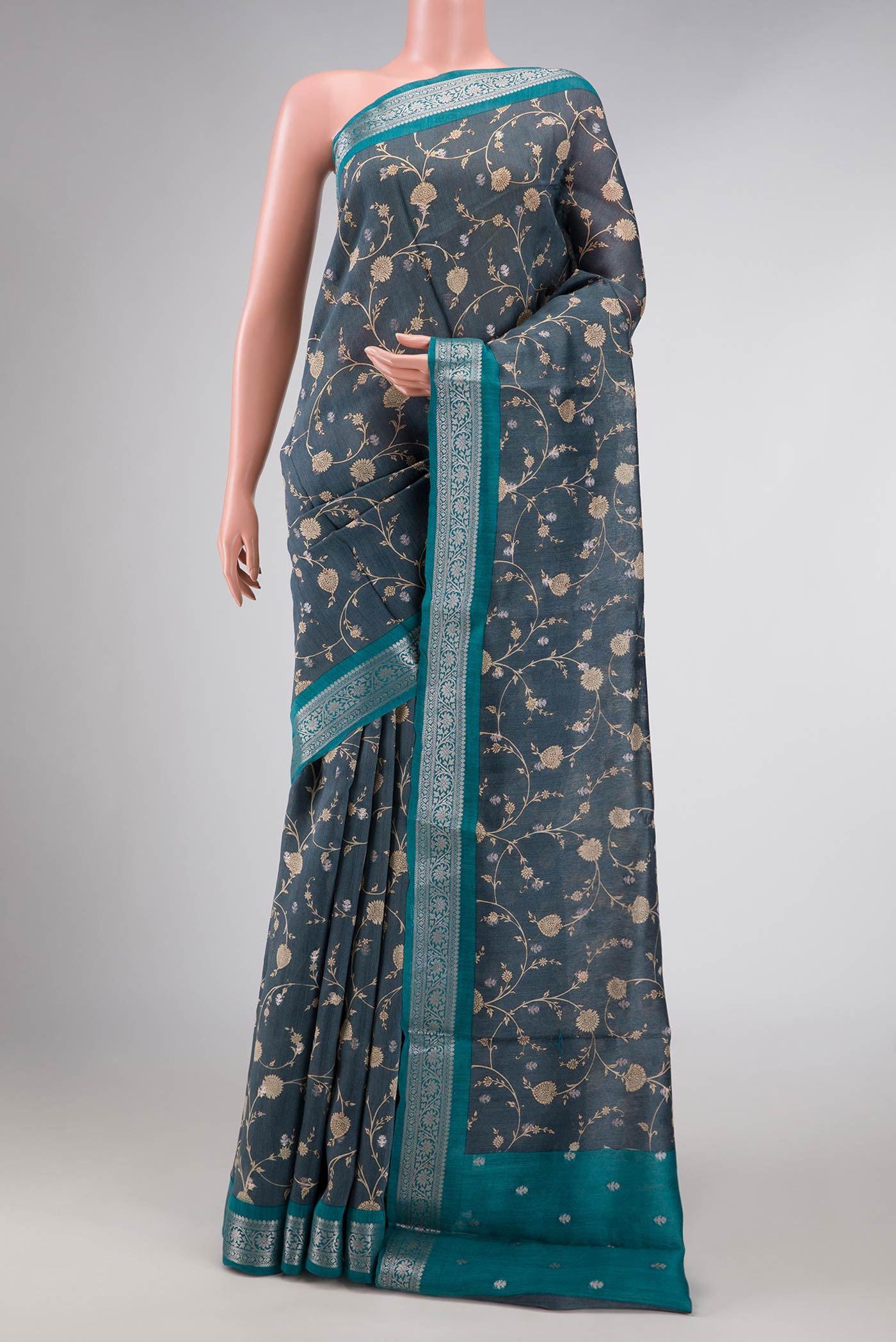 Davys Grey Dual Tone Tussar Silk Saree with Printed design on the body and Zari Border displayed on a mannequin