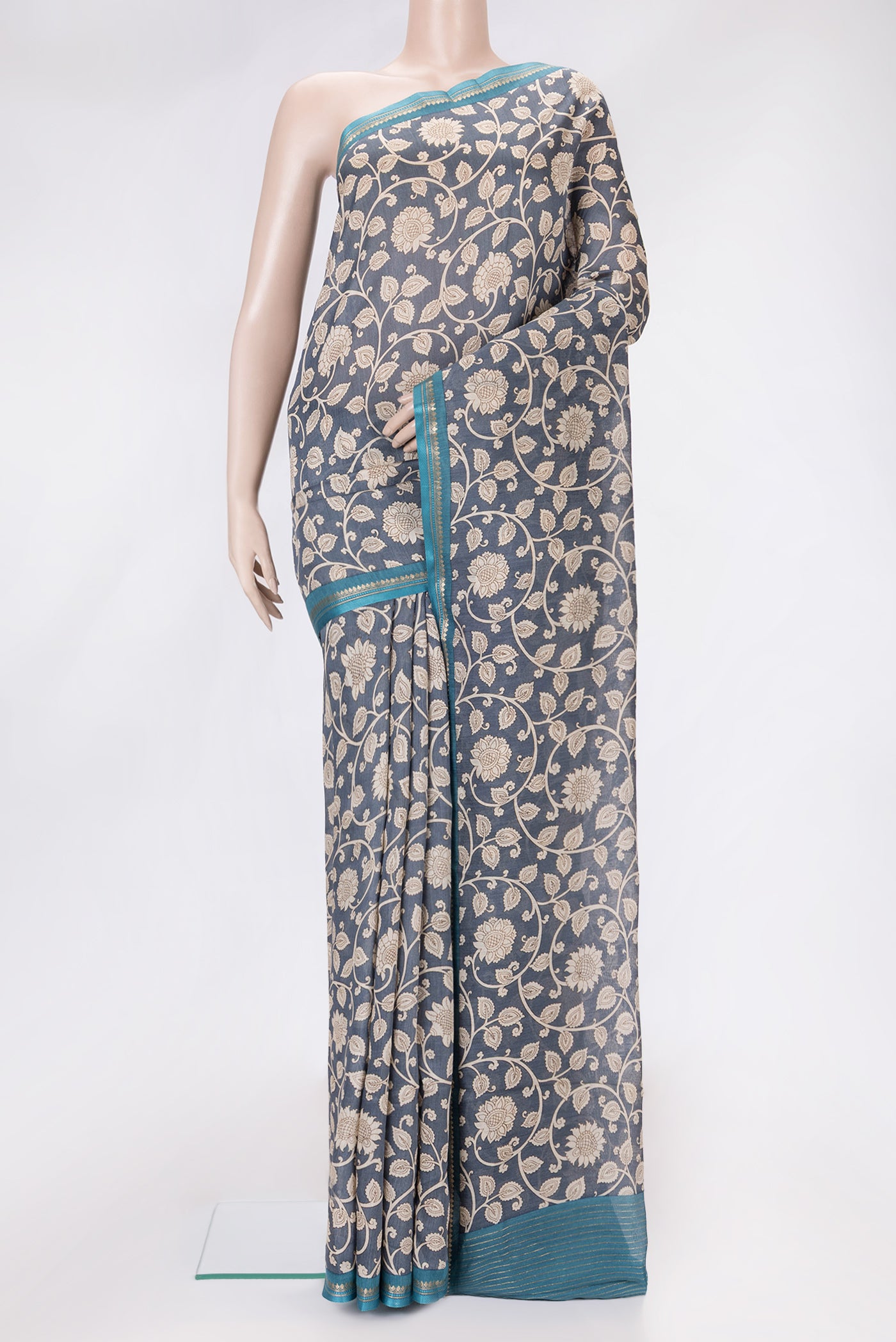 Grey Dual Tone Tussar Silk Saree with Printed design on the body and Zari And Thread Border.  displayed on a mannequin