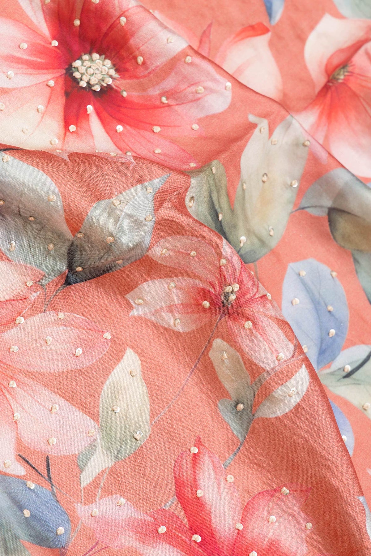 Close up of Peach Dual Tone Tussar Silk Saree with Embroidery on the body and Zari And Thread Border.  displaying folds