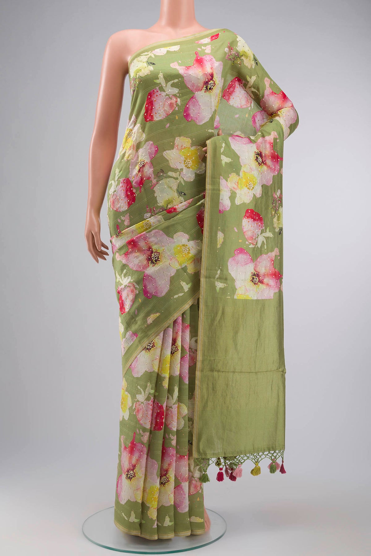 Green Bhagalpuri Tussar Silk Saree with Embroidery on the body and Thin Zari Line displayed on a mannequin