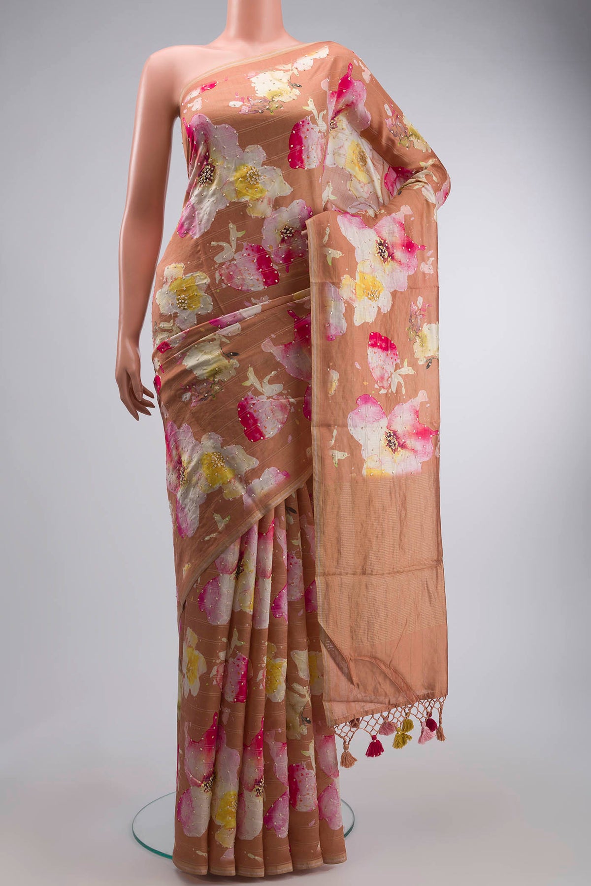 Brown Tussar Silk Saree with Embroidery on the body and Zari Border displayed on a mannequin