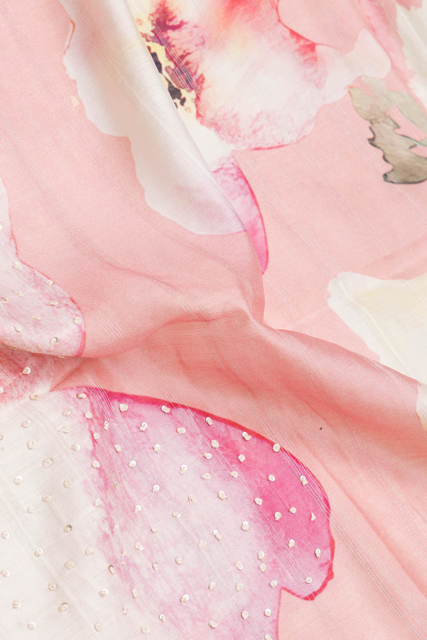 Close up of Pink Dual Tone Tussar Silk Saree with Embroidery on the body and Zari Border.  displaying folds