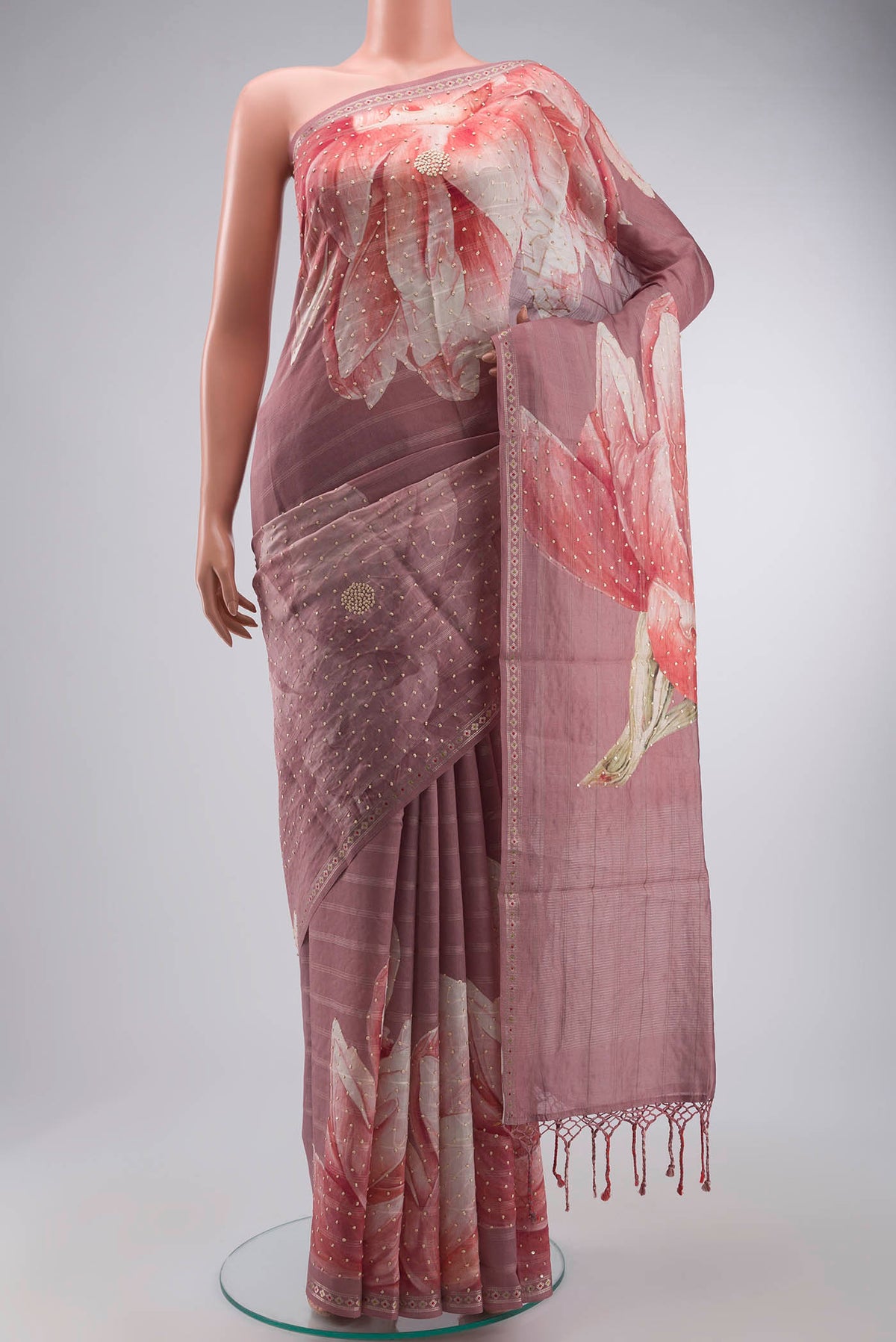 Mauve Tussar Silk Saree with Embroidery on the body and Zari Border displayed on a mannequin