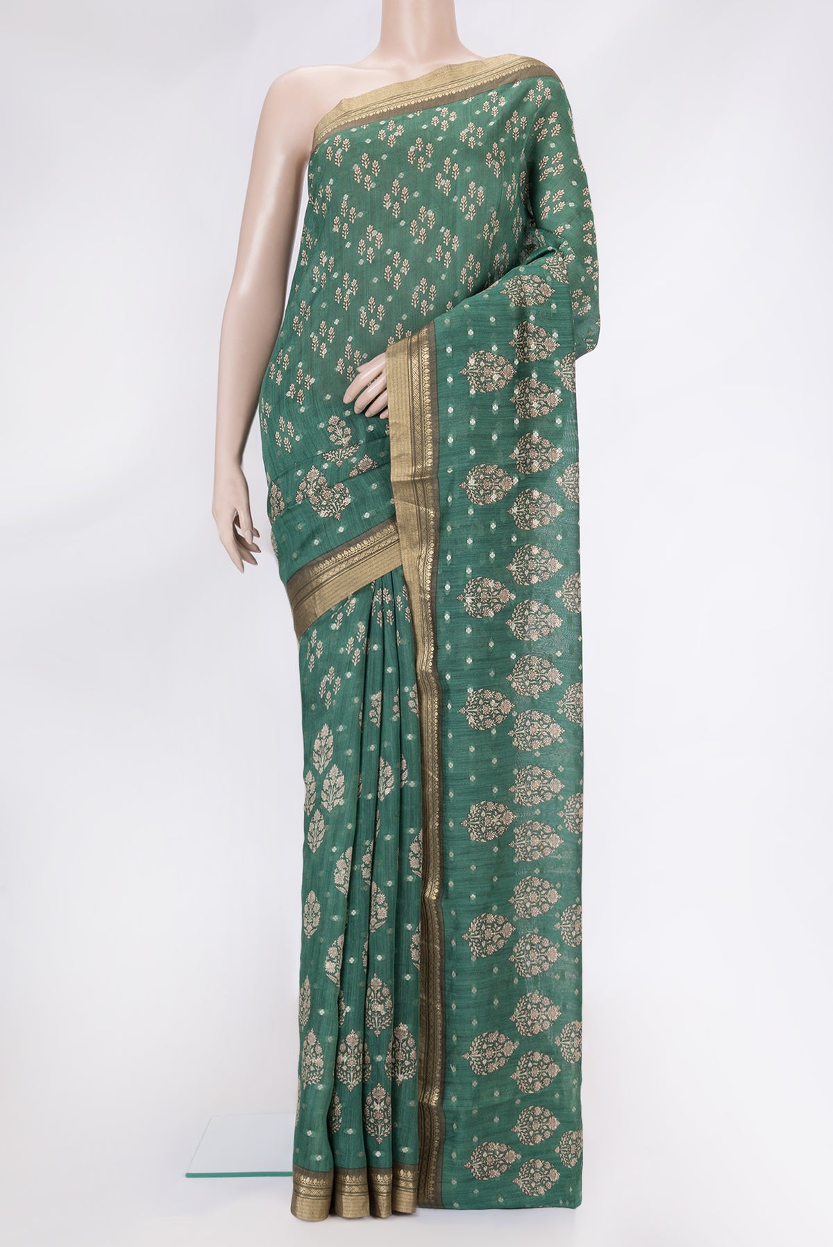 Green Dual Tone Tussar Silk Saree with Printed design on the body and Zari Border.  displayed on a mannequin