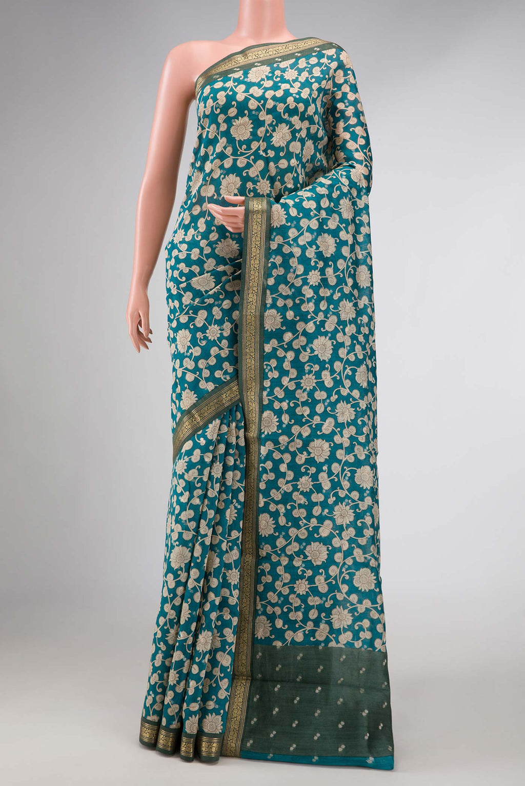 Blue Dual Tone Tussar Silk Saree with Printed design on the body and Zari Border displayed on a mannequin