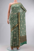 Green Bhagalpuri Tussar Silk Saree with Printed design on the body and Zari Border displayed on a mannequin