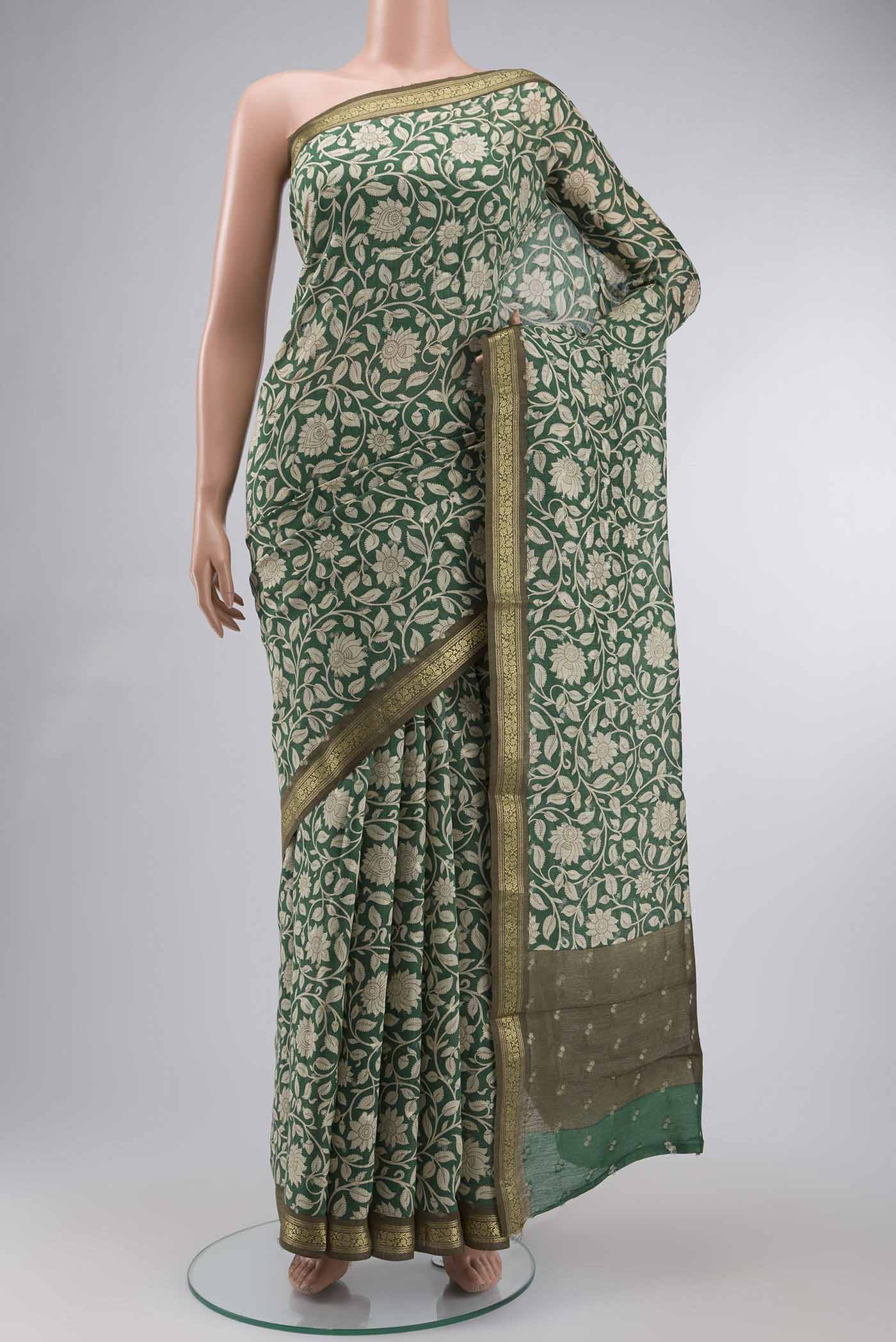 Green Bhagalpuri Tussar Silk Saree with Printed design on the body and Zari Border displayed on a mannequin