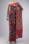 Purple Tussar Silk Saree with Printed design on the body and Zari Border displayed on a mannequin
