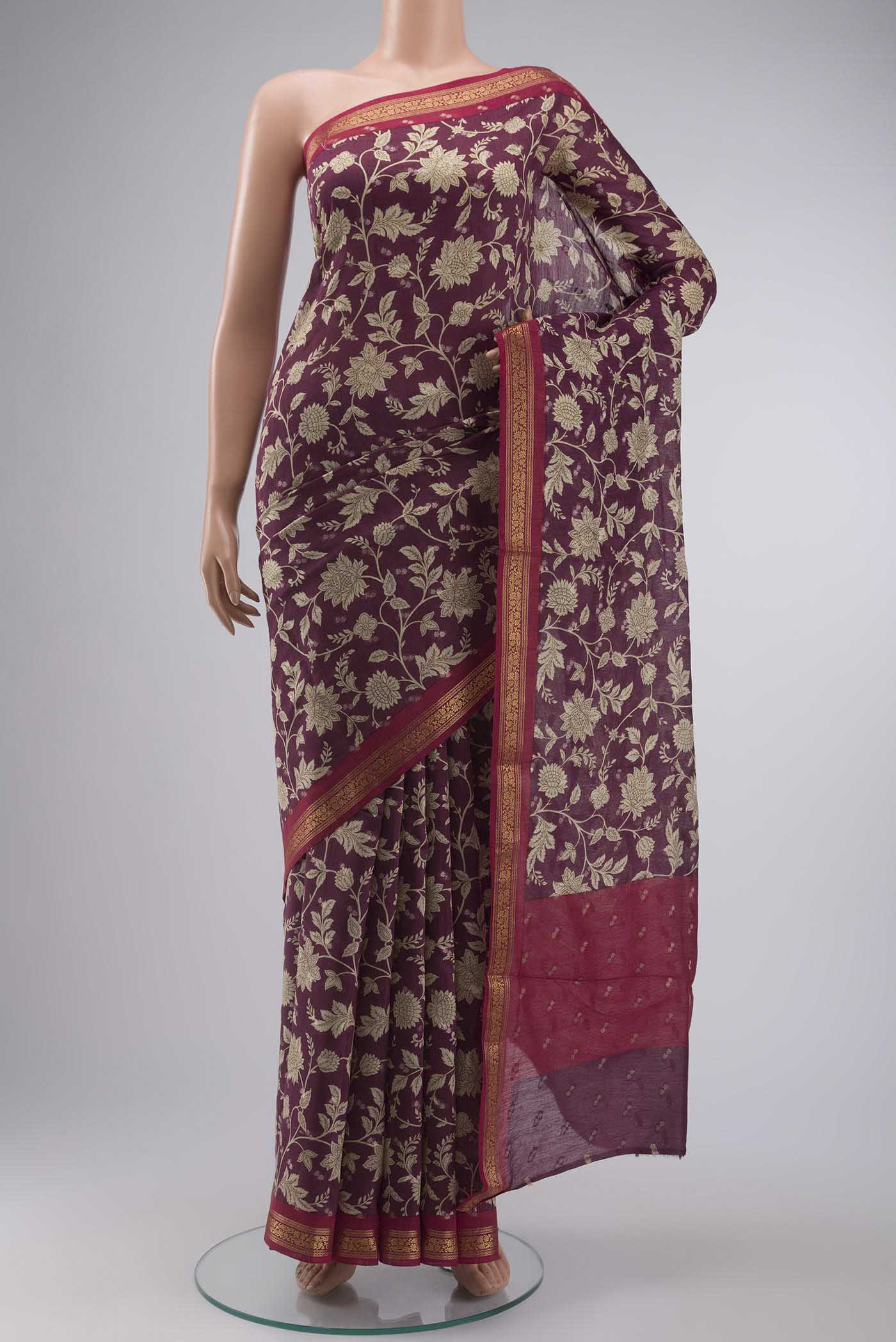 Purple Tussar Silk Saree with Printed design on the body and Zari Border displayed on a mannequin