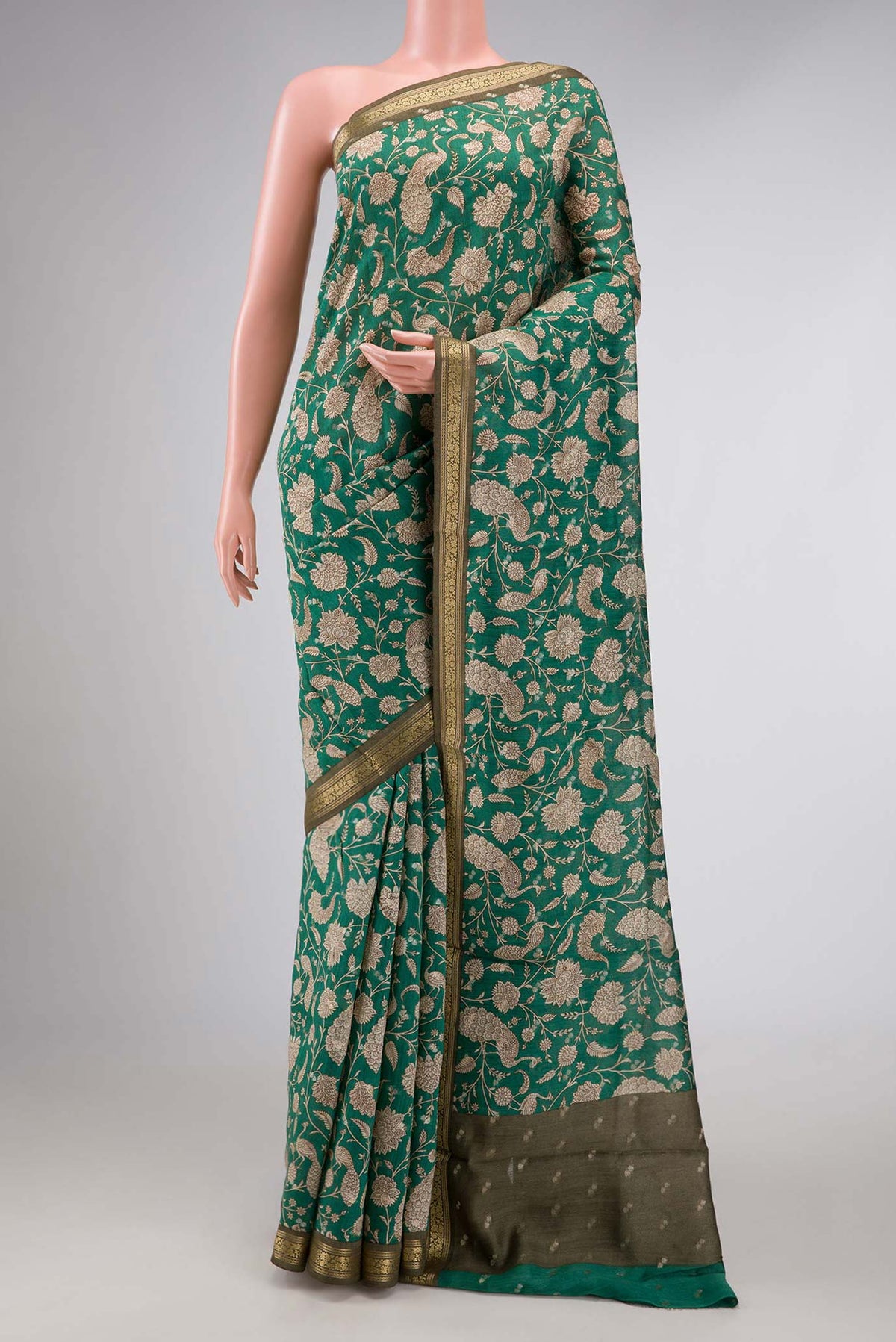 Green Dual Tone Tussar Silk Saree with Printed design on the body and Zari Border displayed on a mannequin