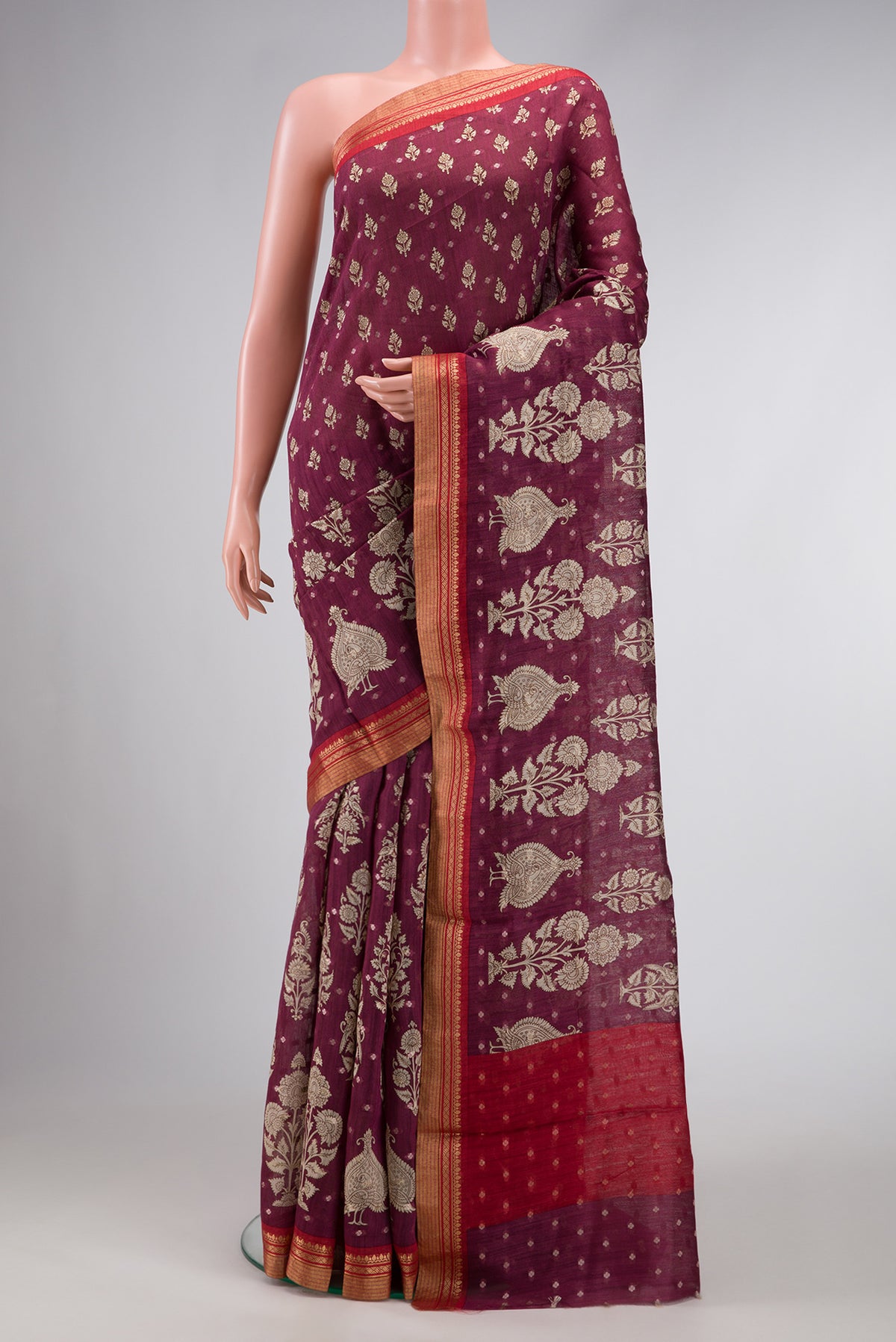Burgundy Dual Tone Tussar Silk Saree with Printed design on the body and Zari Border.  displayed on a mannequin