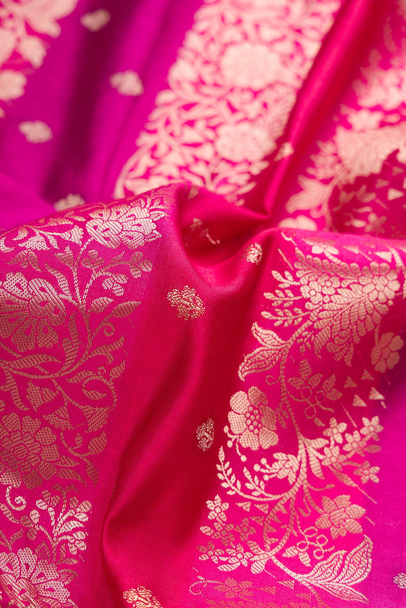 Close up of Purple and Maroon Color Tussar Silk Saree with Zari Butta on the body and Zari Border.  displaying folds