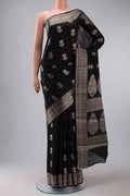 Black Tussar Silk Saree with Zari Butta on the body and Zari Border displayed on a mannequin