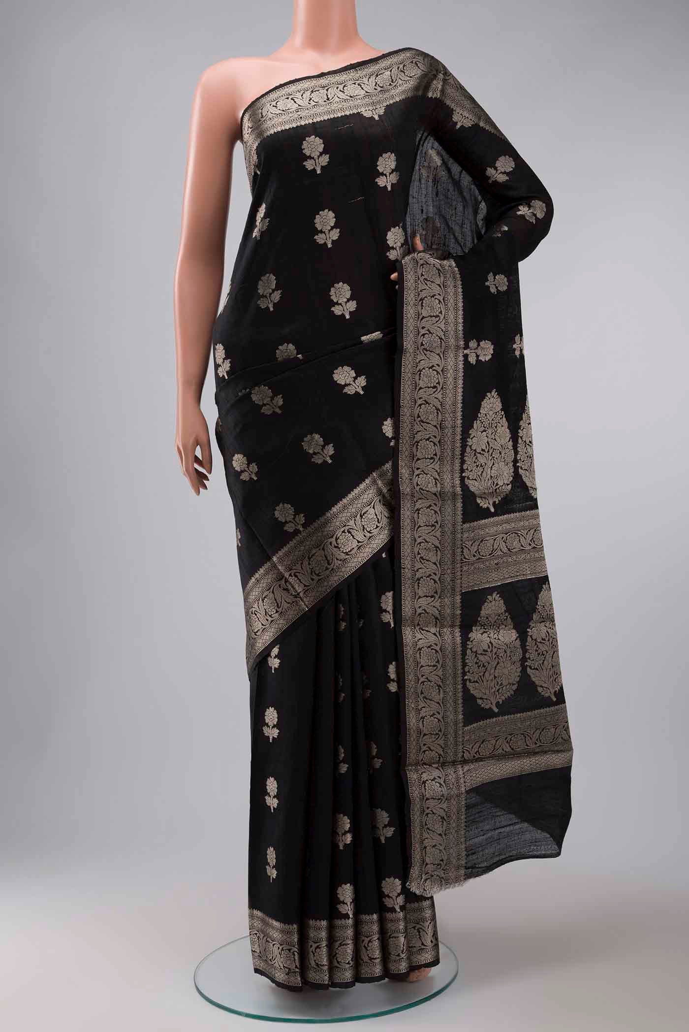 Black Tussar Silk Saree with Zari Butta on the body and Zari Border displayed on a mannequin